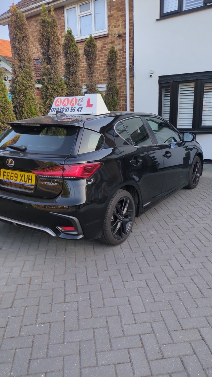 Auto Pass Driving School's black Lexus CT hybrid tuition car with its roof sign, London